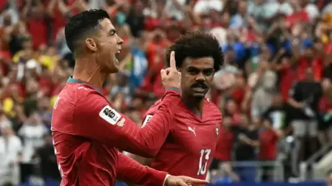 Cristiano Ronaldo celebrates scoring a goal for Portugal against Uzbekistan in Houston.