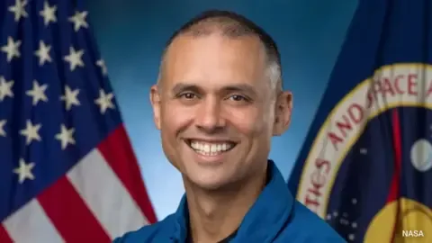 Anil Menon, a former Delhi student, now a NASA astronaut, smiling.