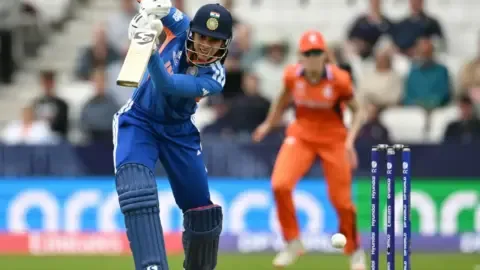 Smriti Mandhana celebrating a milestone during the India vs Netherlands Women's T20 World Cup 2026 match.