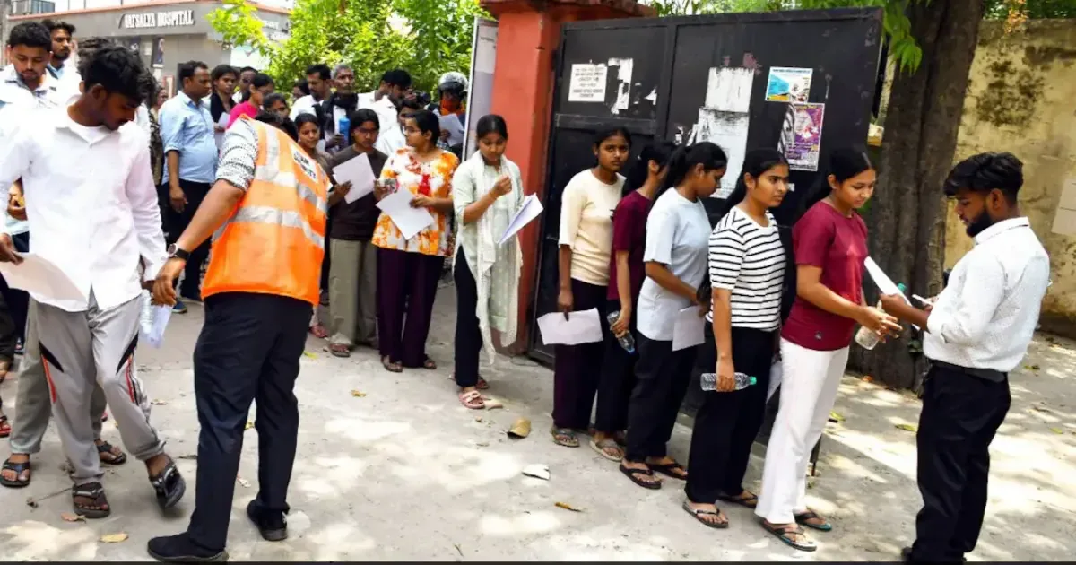 NEET re-exam 2026 security measures in place with students taking the test under camera surveillance.
