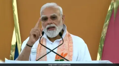 Prime Minister Narendra Modi participates in a yoga session on International Yoga Day.