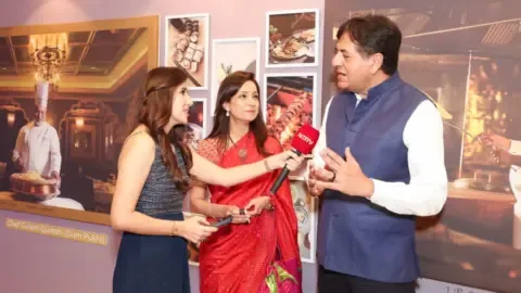 Vikram and Seema Chandra at the NDTV Food Awards ceremony, celebrating their culinary journey.