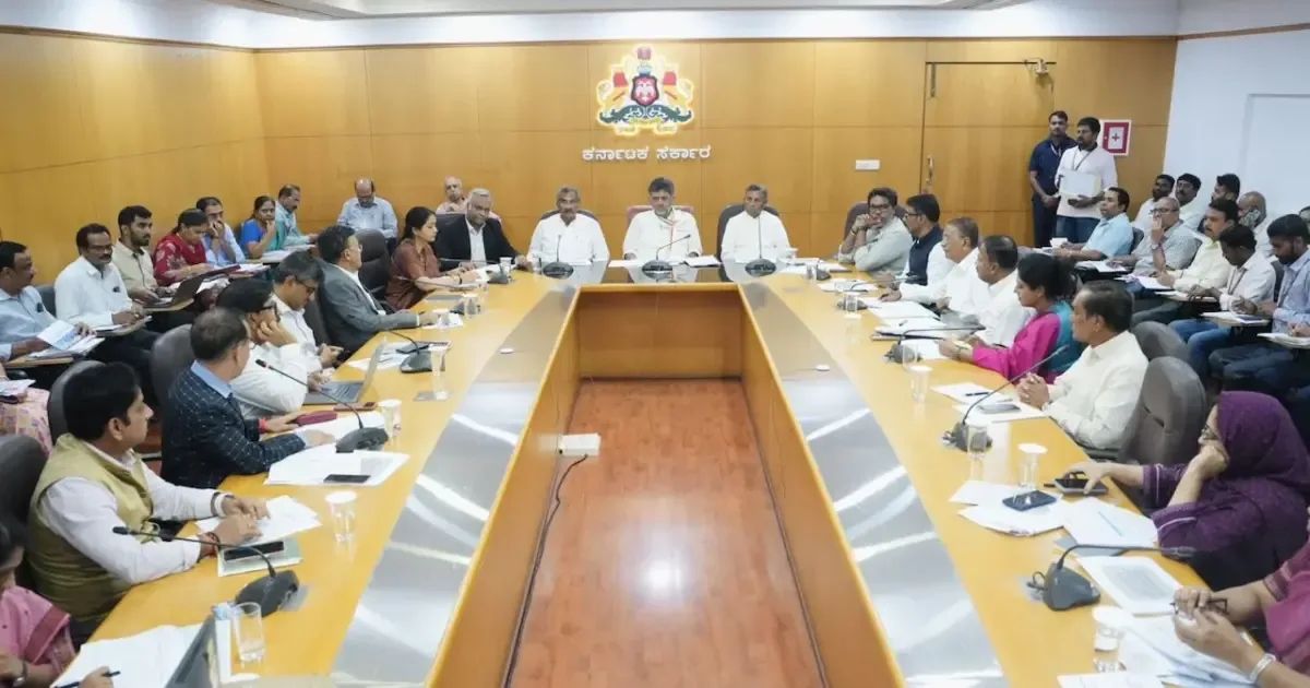 Karnataka government officials reviewing beneficiary lists for welfare schemes.