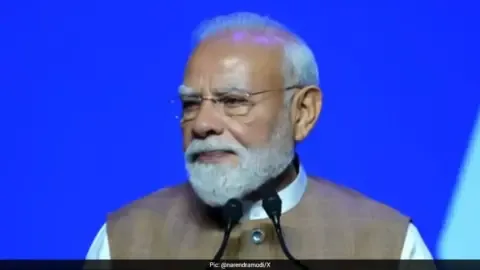 Prime Minister Narendra Modi addressing a gathering in France, highlighting India's role as a trusted partner.