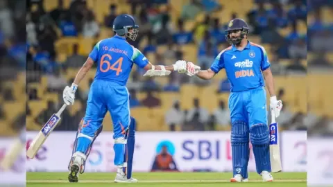 Rohit Sharma leading the Indian cricket team during an ODI match against England.