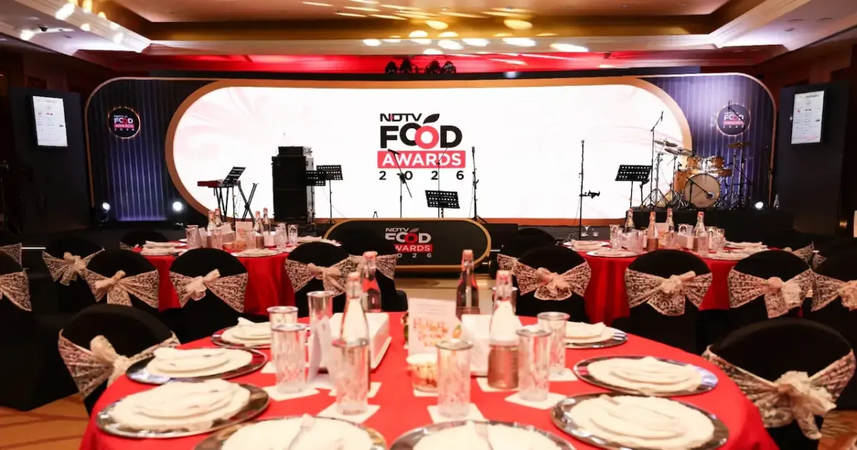 Chefs celebrating on stage at the NDTV Food Awards 2026, holding trophies.