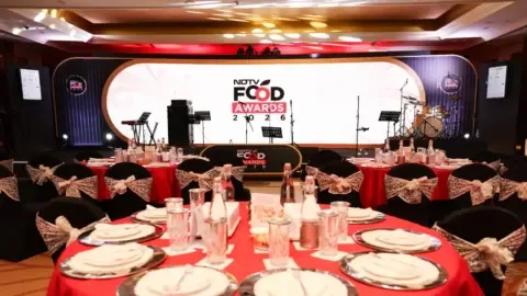 Chefs celebrating on stage at the NDTV Food Awards 2026, holding trophies.