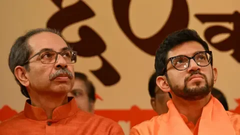 Six Shiv Sena MPs defect from Uddhav Thackeray's faction to join Eknath Shinde's group in Delhi.