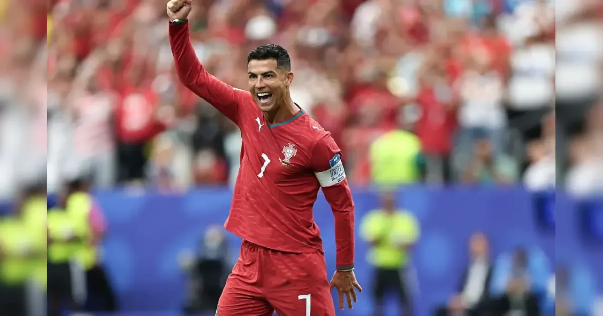 Cristiano Ronaldo celebrating a goal during a World Cup match, highlighting his record-breaking achievement.