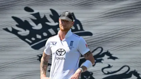 Ben Stokes in action for England during a cricket match.
