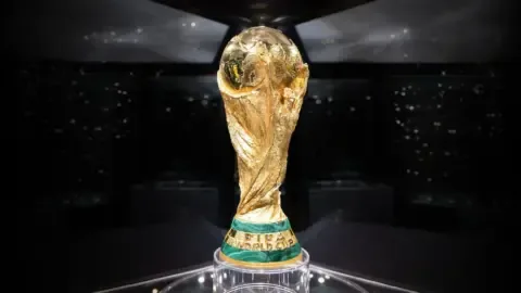 Close-up of the FIFA World Cup trophy, highlighting its gold