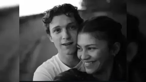 Tom Holland and Zendaya smiling together