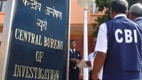 CBI officials apprehending a suspect in connection with the 2021 Bengal post-poll violence murder case.