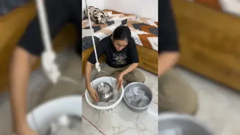 Gujarat woman creatively uses a ceiling fan to make ice cream, showcasing a clever 'desi jugaad' innovation.