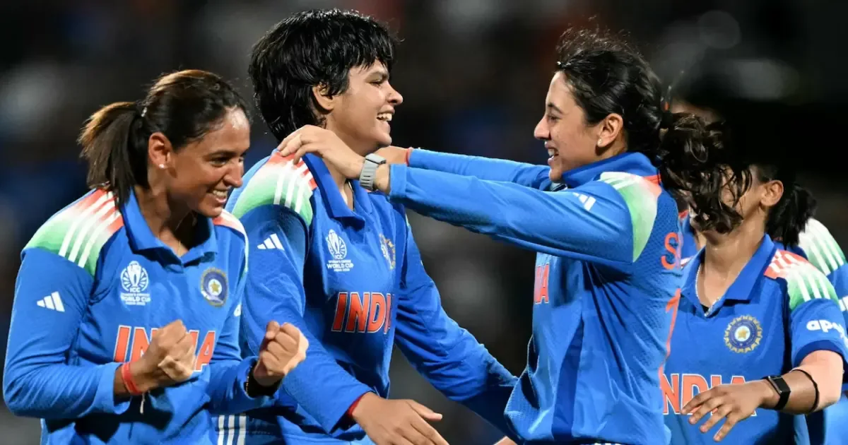 Indian cricketers Shafali Verma and Smriti Mandhana smiling together on the field.
