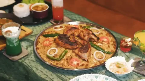 A bustling street food stall in Hyderabad, showcasing a variety of popular dishes, with a focus on the challenges of maintaining hygiene in a high-traffic food hub.