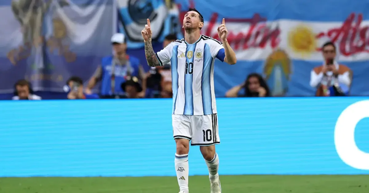 Lionel Messi dribbles past a Cape Verde defender during the intense match.