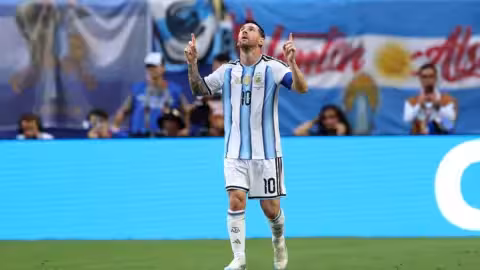 Lionel Messi dribbles past a Cape Verde defender during the intense match.